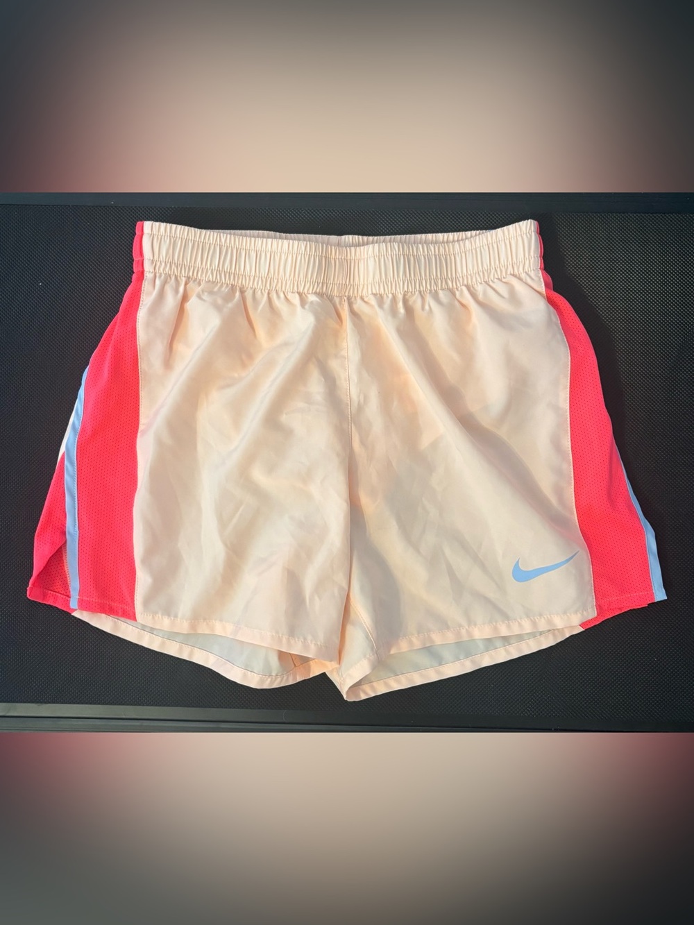 Nike Kid’s Light Peach Athletic Shorts with Sky Blue Swoosh